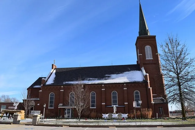 St. Francis Xavier Catholic Church , located at 7319 Route M in Taos, Missouri . The church, along with its rectory, is listed on the National Register of Historic Places .