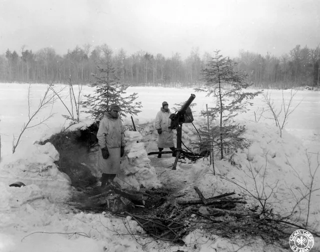 SC 364475 - 50. cal. liquid-cooled M.G. emplacement at Lake James being manned by Pfc. Theron D. Davis, Lee Summit, Missouri, and Pvt. Lawrence Hayden, Waco, Texas, of 456 C.A. Ba...