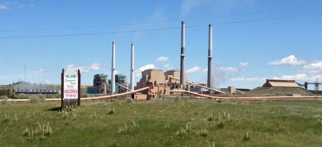 Sign for Colstrip with Plants in background