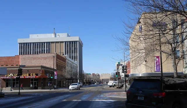 Central Avenue, Great Falls, Montana, looking west from intersection of 4th St. N. Civic Center at end of street, old Paris of Montana department store building (Now housing NEW)...