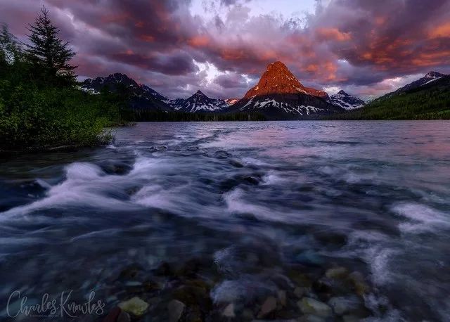 Inlet water ripples into Two Medicine Lake morning sunrise
