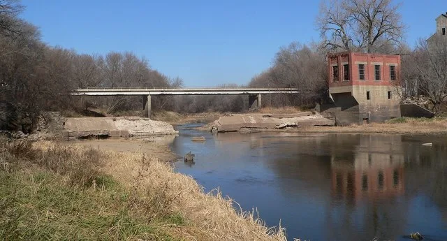 Remains of dam and hydroelectric plant on Big Blue River at eastern edge of Blue Springs, Nebraska. Camera is facing generally northward (upstream).