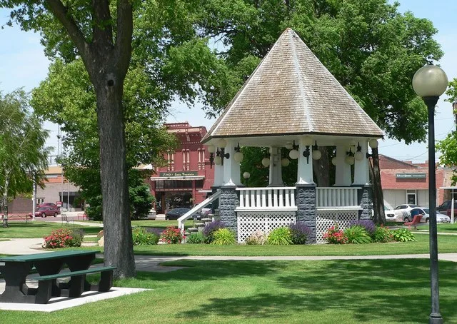 Bandstand in public square in downtown Broken Bow, Nebraska ; seen from the east. Visible in the background is the 800 block of South D Street; the building behind and immediately...