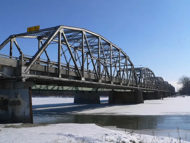 Columbus Loup River Bridge , carrying U.S. Highway 81 across the Loup River at the southern edge of Columbus, Nebraska ; seen from the northwest (upstream). The Parker through tru...