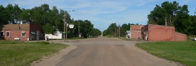 Crab Orchard, Nebraska: 725 Rd, looking east from a point west of Tierney Street. The building to the right is the post office.