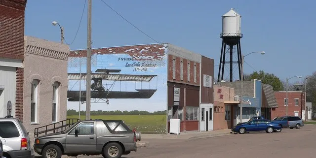 Downtown Ewing, Nebraska : north side of East Nebraska Street. The mural commemorates the Savidge brothers, who were among the first aviators in Nebraska.