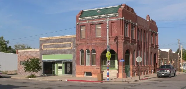 Downtown Grant, Nebraska: northeast corner of 3rd and Central, seen from the southwest. Central Avenue runs northward to the left; 3rd Street runs eastward at the right edge of th...
