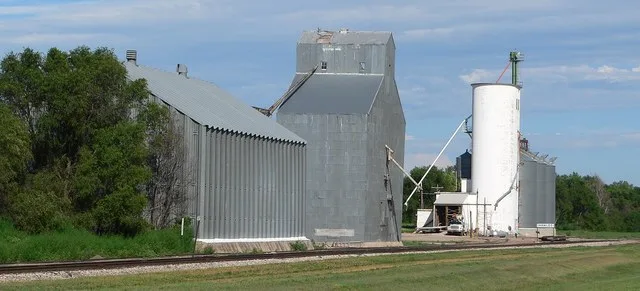 Grain elevators at southern edge of Hamlet, Nebraska .