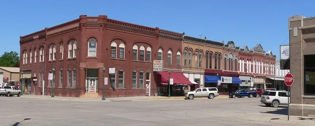Northwest corner of Main and Fulton Streets in Hooper, Nebraska . Main runs north-south; Fulton runs east-west. The buildings shown on the west side of Main are all part of the Ho...