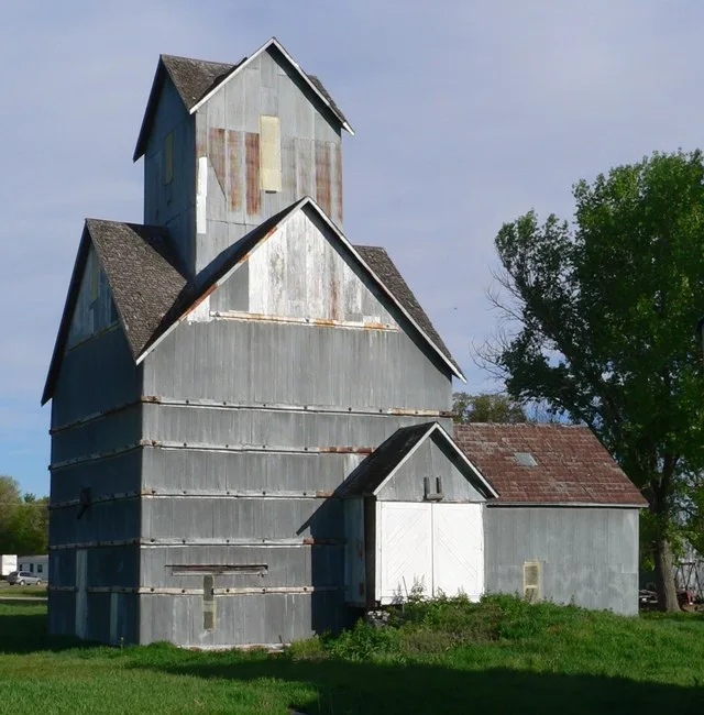 Old Ithaca Grain Elevator in Ithaca, Nebraska ; seen from the southeast. (The elevator is not oriented with its sides parallel to the cardinal directions.) Made of wood and covere...