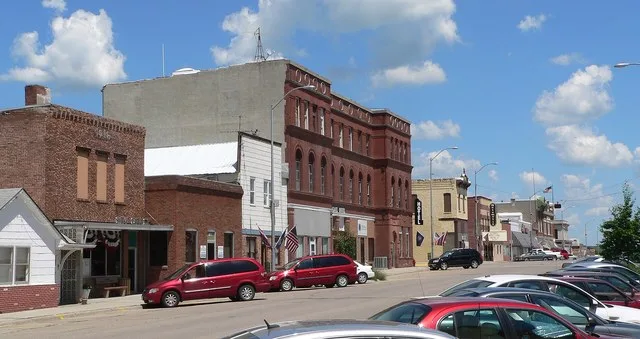 Downtown Pender, Nebraska : north side of Main Street, looking northeast from about 5th and Main. The three-story brick building in the center of the photo and the two-story white...