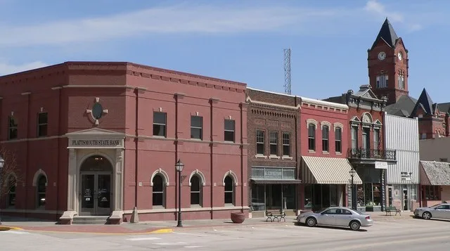 North (even-numbered) side of the 400s block of Main Street in Plattsmouth, Nebraska . The block is part of the Plattsmouth Main Street Historic District , which is listed in the...