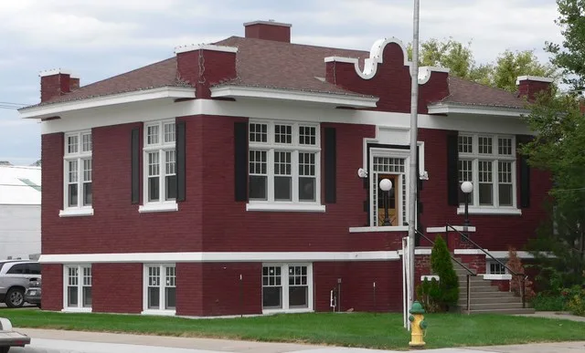 Sidney Carnegie Library building in Sidney, Nebraska ; seen from the southwest. The Jacobethan building was constructed in 1914. It is listed in the National Register of Historic...