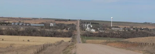 Stamford, Nebraska , seen from the south. The line of trees in the foreground is along Sappa Creek.