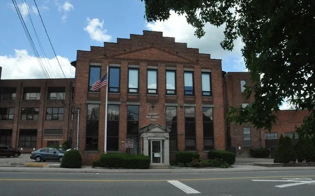 THIS BUILDING ONCE WAS PART OF ONE OF THE OLDEST HARD RUBBER FACTORIES IN THE WORLD. A SMALL RUBBER COMPANY, WHICH OPERATED HERE SINCE 1869, EXPANDED INTO A HIGHLY SUCCESSFUL OPER...