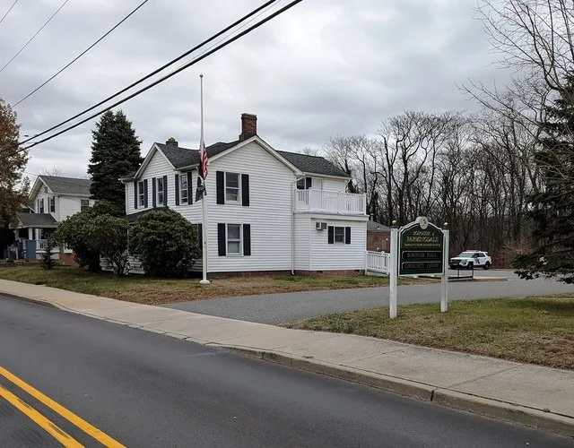 Photo of the Farmingdale , New Jersey municipal building. Photo taken from County Route 547 (Asbury Avenue) looking east-northeast.