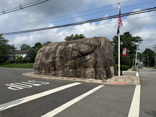 A large boulder in the middle of a street named the Glen Rock in Glen Rock, New Jersey, US