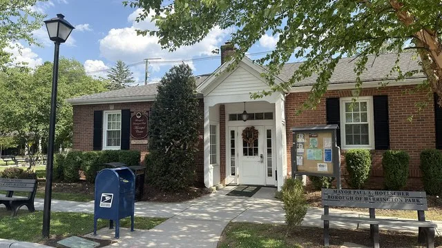 Photo of the Harrington Park Borough Hall in the summer.