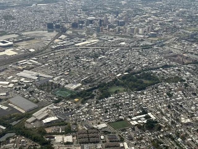 Aerial view centered on Harrison, Hudson County, New Jersey (also visible: Newark top, East Newark right, Kearny lower right) from an aircraft which just departed from Newark Libe...