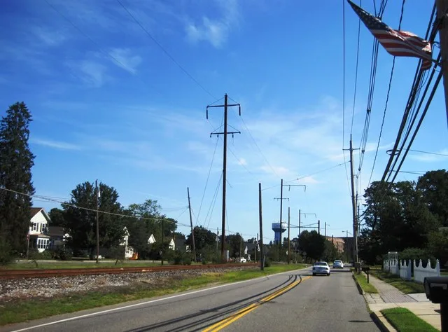 Photo of the center of Helmetta , New Jersey . Photo taken along northbound Main Street ( County Route 615 ) approaching Willow Street. The Camden and Amboy Railroad , formerly el...