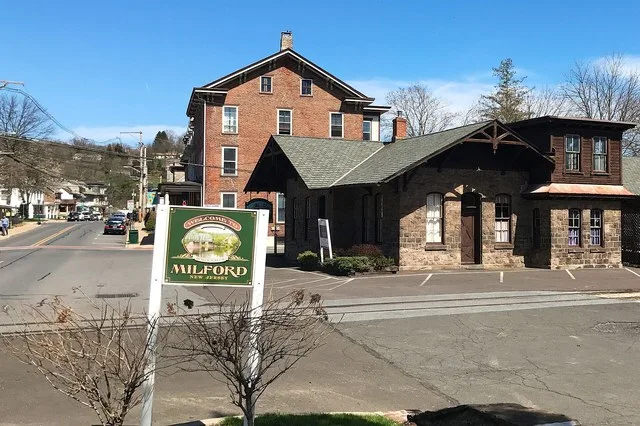 View of Bridge Street, by Railroad Avenue, in Milford, New Jersey . Shows former station of the Belvidere Delaware Railroad in the foreground. Contributing property #2 of the Milf...