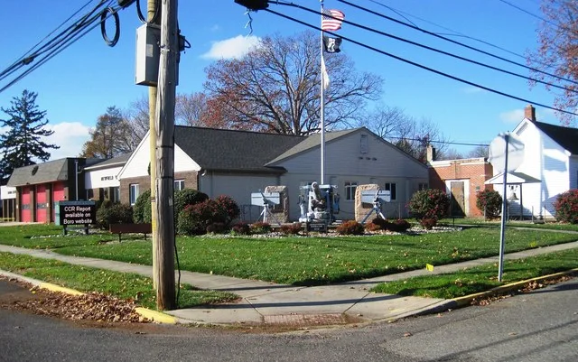 Photo of the Newfield , New Jersey municipal building. In the foreground is Newfield Veterans Memorial Park. Photo taken from County Route 661 (Catawba Avenue) at Church Street lo...