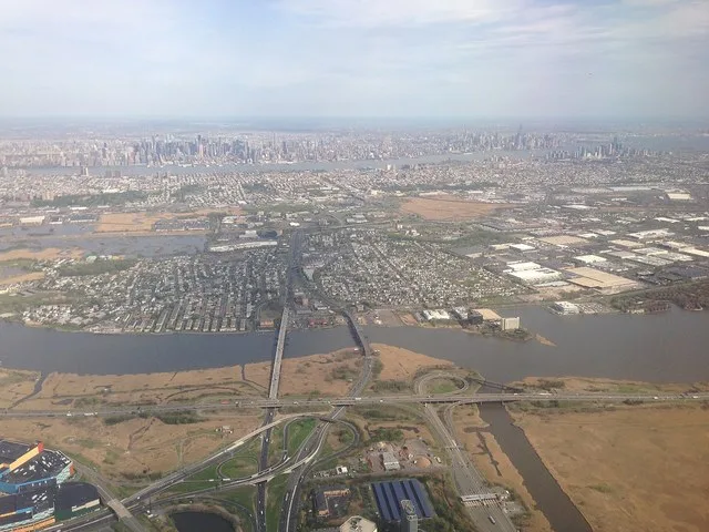 View of New York City, Secaucus, New Jersey, the Hackensack River, the New Jersey Turnpike Western Spur and New Jersey Route 3, looking southeast from an airplane heading for Newa...