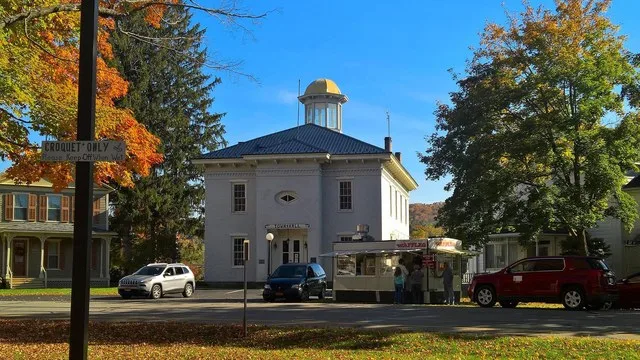 Local residents line up for hot, tasty carnival-style waffles at a trailer in front of the Town Hall on Park Circle in Angelica, New York, on a beautiful October 2016 afternoon. T...