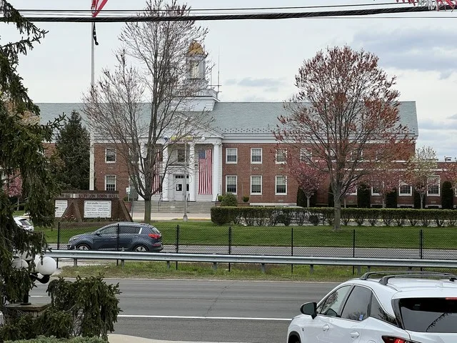 The present-day Babylon Town Hall in North Lindenhurst, NY on April 21, 2024. This image was taken from the South Bay Diner, located across the street (Sunrise Highway (NY 27)). T...