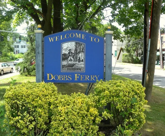 Looking northwest at Dobbs Ferry, New York welcome sign, west of the Ashcroft Avenue bridge from Ardsley.