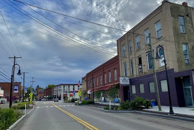 A view southward along State Route 14A in the village of Dundee, New York, as seen on an October 2022 evening. The foreground portion of the street is called Water Street, but it...