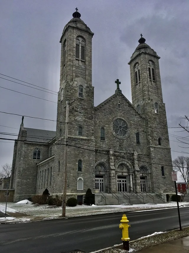 St. Matthew Roman Catholic Church, 229 West Yates Street at Kinne Street, East Syracuse, New York, March 2021. A very late-period yet also very typical example of Romanesque Reviv...