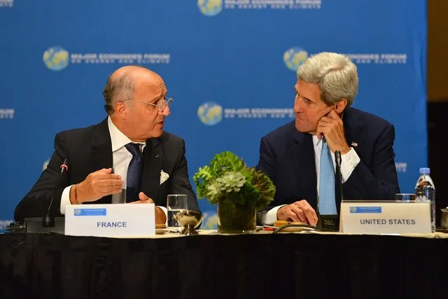 U.S. Secretary of State John Kerry speaks with French Foreign Minister Laurent Fabius at the Major Economies Forum (MEF) Ministerial, on the sidelines of the 70th Regular Session...