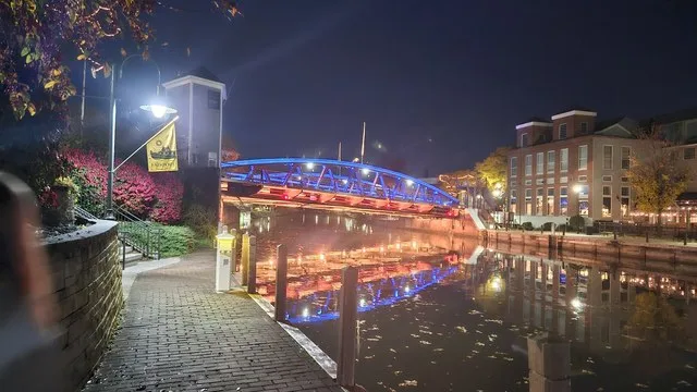 Night view of the Erie Canal and Main Street bridge passing through Fairport NY