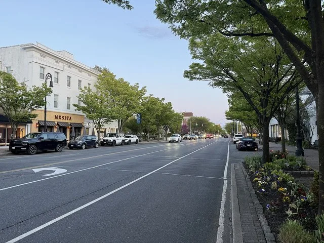 Franklin Avenue (CR 5A) in the downtown area of the Incorporated Village of Garden City, NY, at sunset on on May 3, 2026, looking south from just north of Stewart Avenue (CR 177).