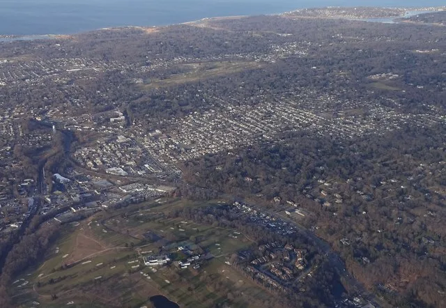 Glen Cove, NY and its vicinity, as seen from the air over the hamlet of Glen Head, looking north. Both communities are in the foreground.