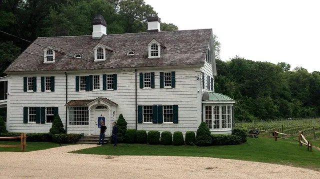 The c.1690 farmhouse within the East Farm Estate in the hamlet of Head of the Harbor, New York. The building is as of 2014 used as a wine tasting room as part of an active winery...