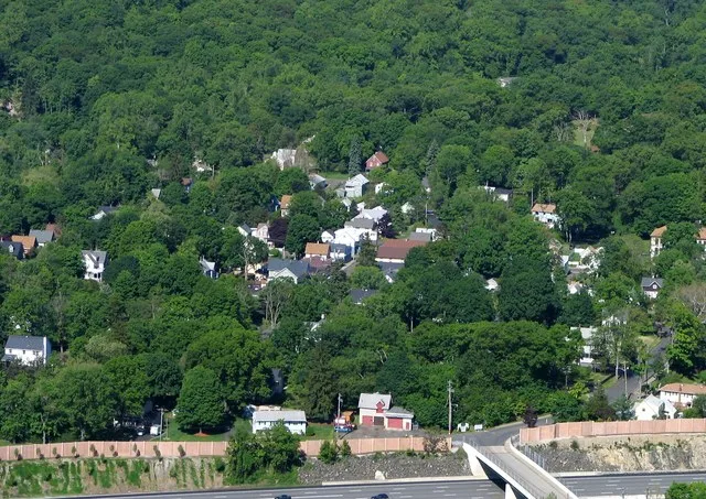 Hillburn, NY, taken from Nordkop Mtn, looking west. New York State Thruway (I-87) in foreground. Taken by User:Mwanner on 28 May, 2005.