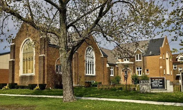 Knox Evangelical Presbyterian Church, 2595 Elmwood Avenue at Kinsey Avenue, Kenmore, New York, May 2021. A brown brick edifice with a Late Gothic Revival design typical of the ecc...