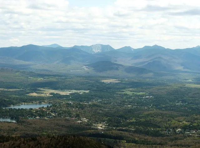 Lake Placid from McKenzie Mountain, Mirror Lake at left, Gothics in back center
