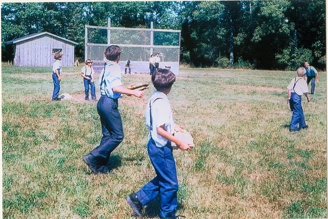 Amish boys playing baseball in Lyndonville, New York, USA