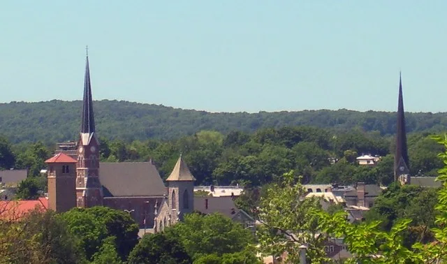 Skyline of downtown Middletown , NY, USA, seen from vicinity of Horton Memorial Hospital. First Congregational Church is tall spire at left