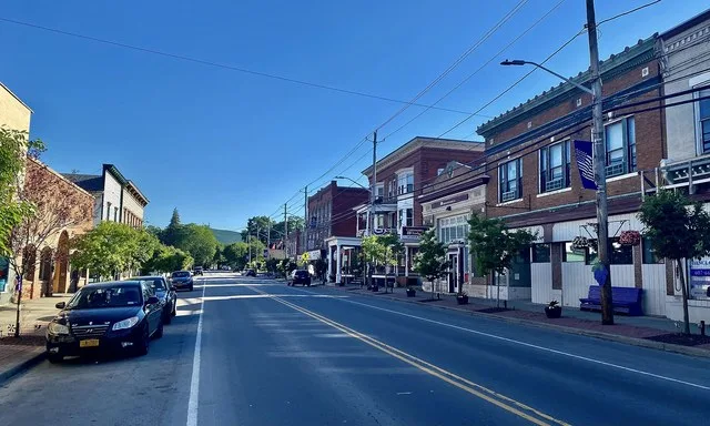 A view along South Main Street in the business district of Naples, New York, as seen on a pleasant June 2021 evening.