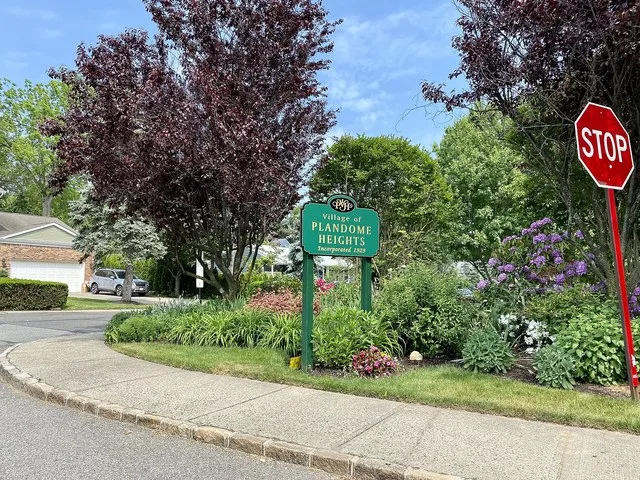 A welcome sign to Plandome Heights, Long Island, New York. This sign is located on Webster Avenue at the end of the Webster Avenue Bridge. This photo was taken on May 26, 2021.