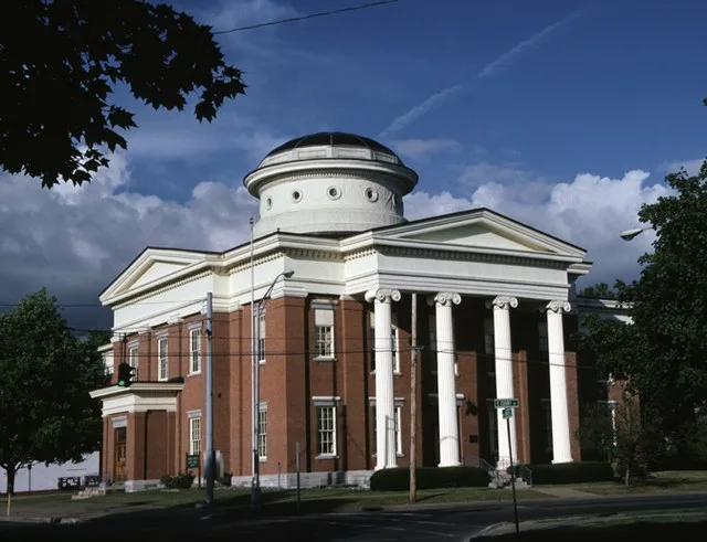 Photograph of the 1851 Oneida County Courthouse in Rome, New York . The architecture is in the Greek Revival style that was popular in Upstate New York in the 19th century. This c...