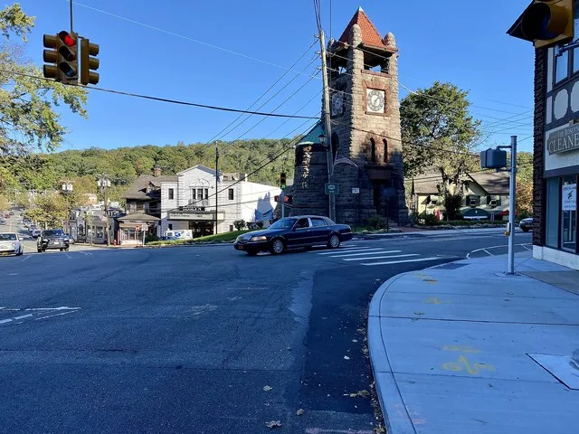 Downtown Roslyn, Long Island, New York on October 17, 2020. The historic buildings along Old Northern Boulevard are visible to the left of the famed Ellen Ward Clock Tower – Rosly...