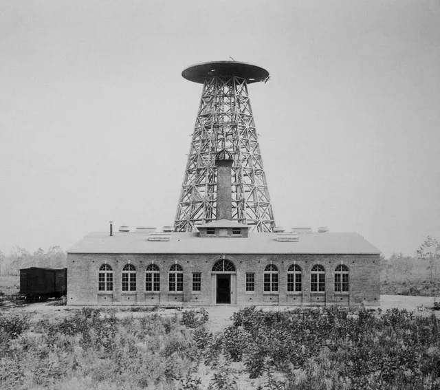 Tesla's Wardenclyffe plant on Long Island in partial stage of completion. Work on the 55-foot diameter cupola had not yet begun. Note what appears to be a coal car parked next to...