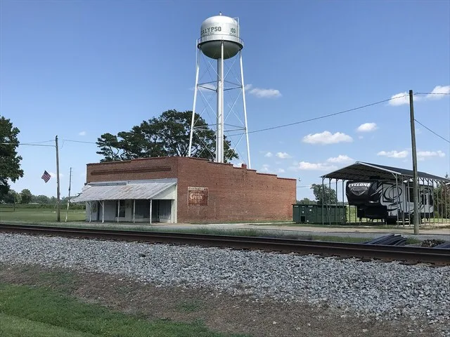Old building and water tower near center of Calypso