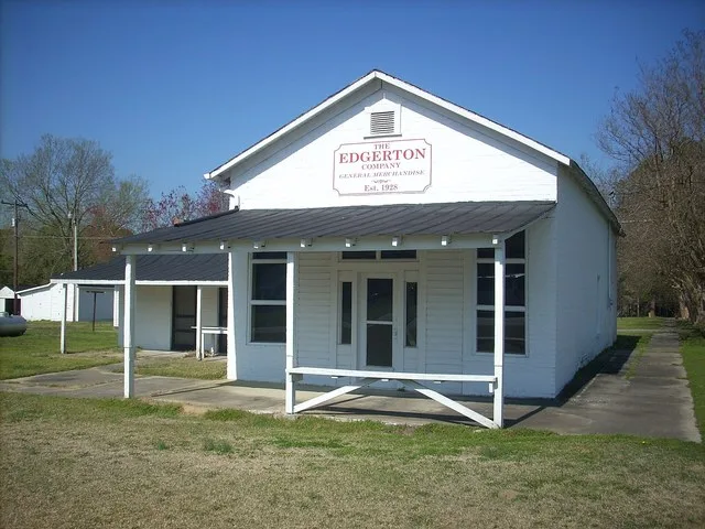 The Edgerton Company. This is an old general store on the RR tracks in Godwin. The exterior appears to be in very nice condition. The windows are boarded up on the interior.