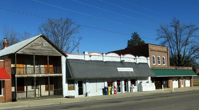 Some of the buildings along the railroad tracks on the main thoroughfare.